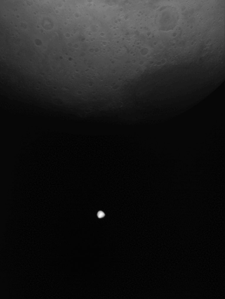 The Martian moon Deimos is seen crossing the disk of Mars