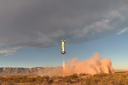 Blue Origin New Shepard suborbital rocket flying above the Texas desert during a mission