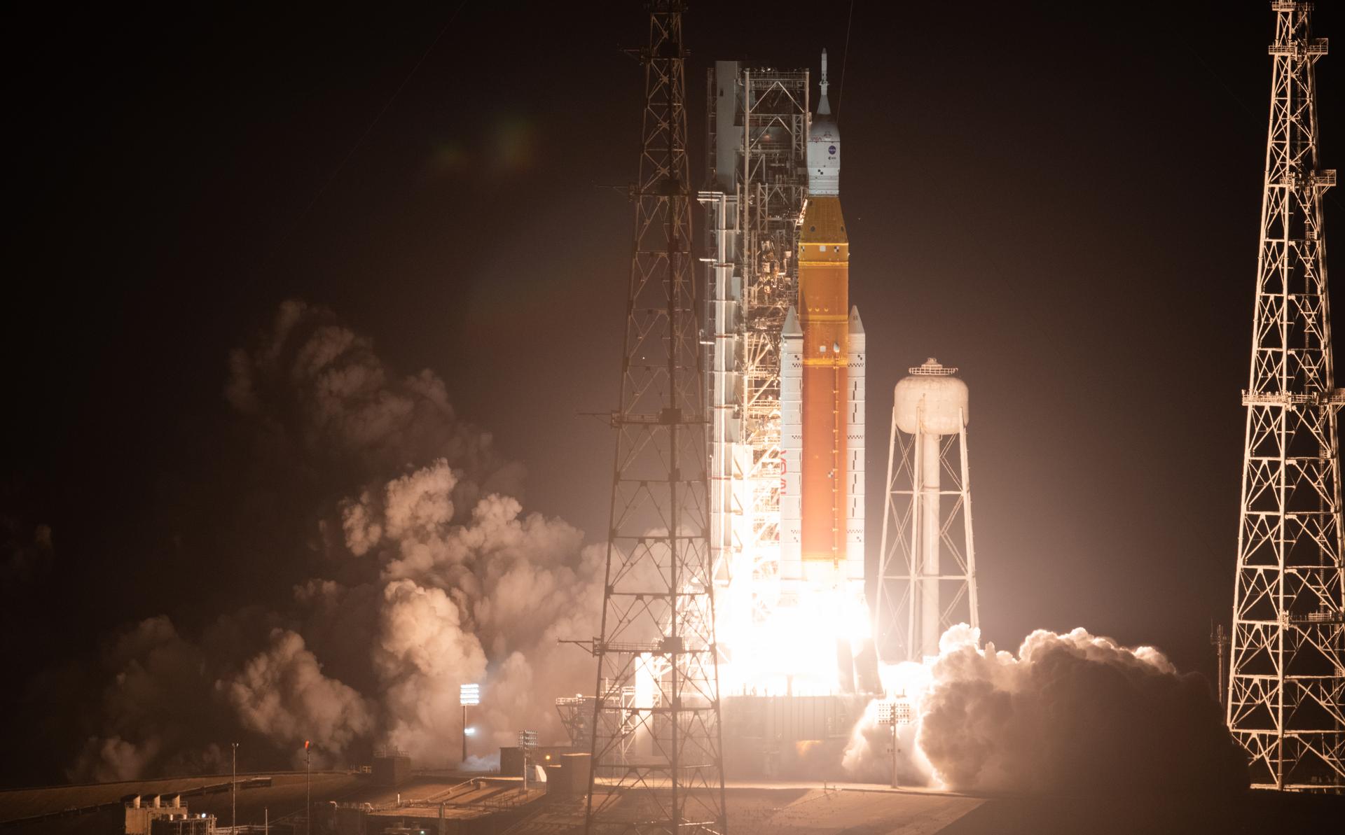 NASA’s Space Launch System (SLS) rocket lifting off during an Artemis mission launch from Kennedy Space Center.