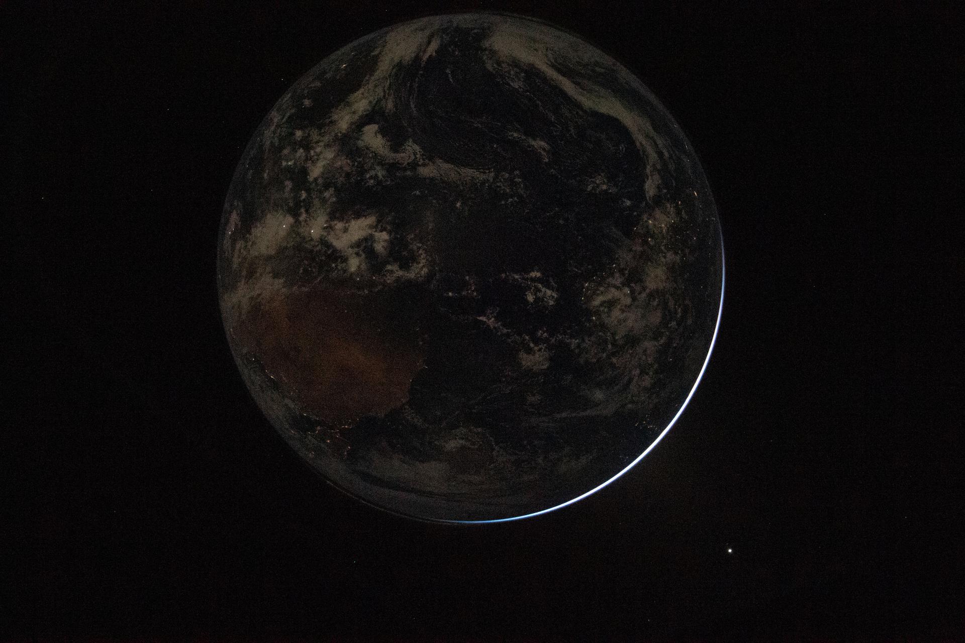 Backlit Earth from Orion Artemis II NASA