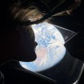 Christina Koch looking at Earth from Orion Artemis II NASA