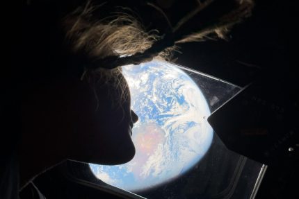 Christina Koch looking at Earth from Orion Artemis II NASA